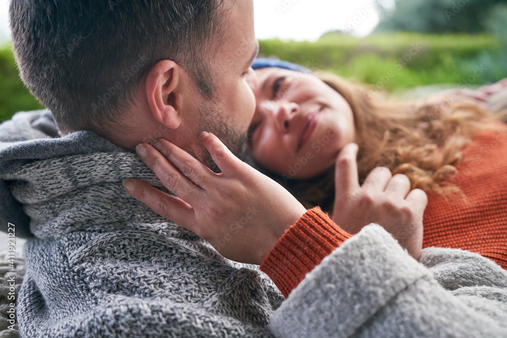 Close up affectionate romantic couple cuddling Close up affectionate romantic couple cuddling