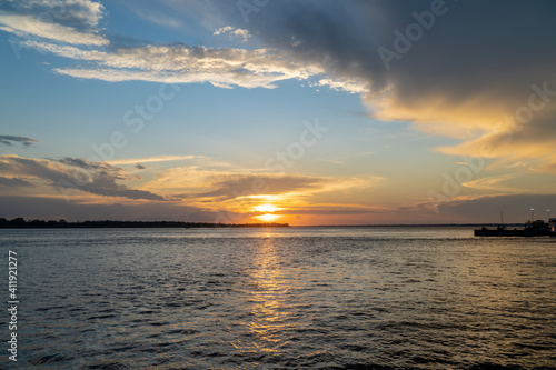 Beautiful sunset view on the Amazon River and colorful clouds. Amazonas  Brazil. Concept of environment  ecology  nature  conservation  travel destination  idyllic landscape  climate change.