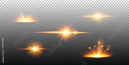 Set of flashes, lights and sparks. Abstract golden lights isolated on a transparent background.