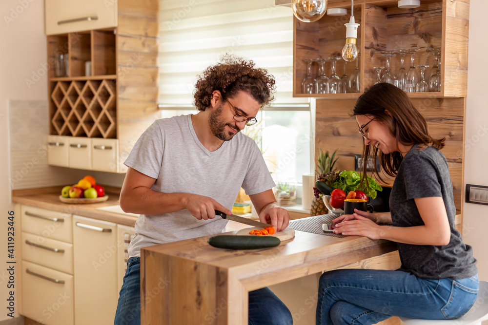 Couple cooking together in the kitchen Couple cooking together in the kitchen