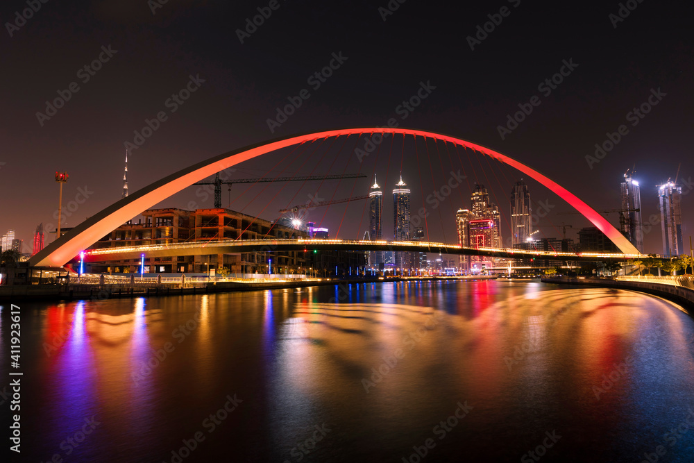 Tolerance Bridge Dubai at night. Famous tourist attraction place to visit in holidays. Modern architecture design.