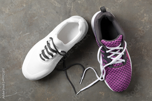 Pair of stylish shoes with laces on grey background, flat lay