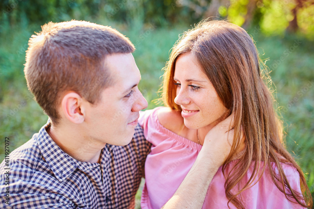 Young couple in love outdoor.Stunning sensual outdoor portrait of young stylish fashion couple posing in summer in field. Young couple in love outdoor.Stunning sensual outdoor portrait of young stylish fashion couple posing in summer in field.
