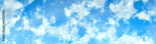white fluffy clouds on a sky blue sky background in high resolution