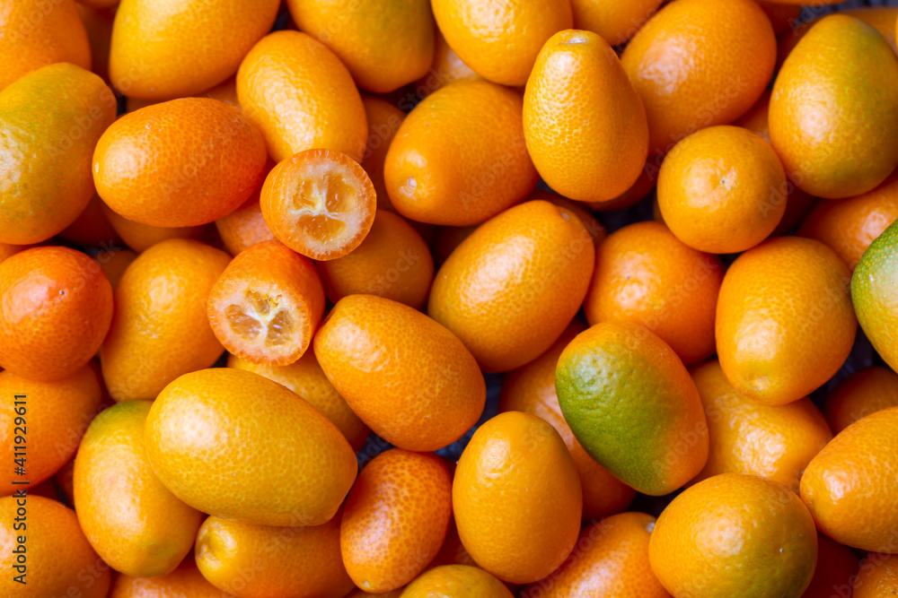 Top view of bunch of fresh kumquats in the organic food market. Top view of bunch of fresh kumquats in the organic food market.