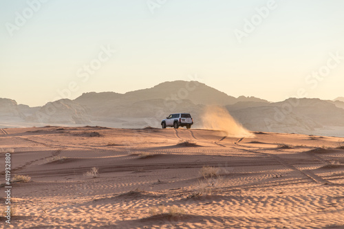 SUV on a background of mountains in the desert