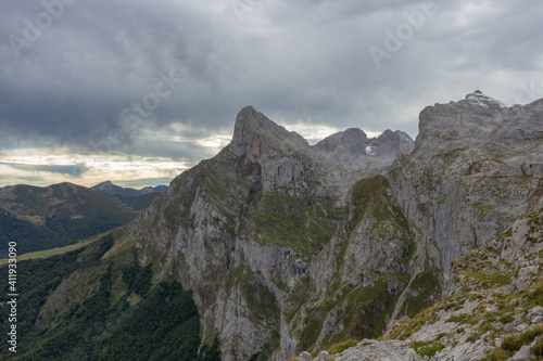 The Majestic mountains of the Eastern Massif of the Picos de Europa. Eagle flying over Pena Remona. The Eastern Massif, or Andará, between the Duje and Hermida gorges.