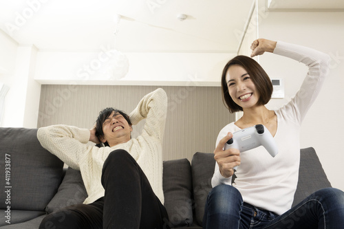 Couples enjoying the latest video games / Couples enjoying games with lovers / Couples crazy about game consoles  photo