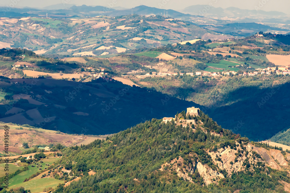 Panoramic view of the landscape surrounding the Republic of San Marino with the Castle of Montebello di Torriana in the foreground, Italy