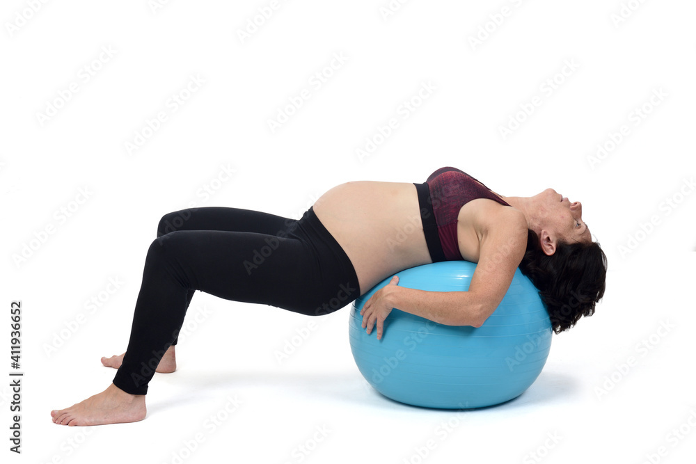 pregnant woman exercising with a ball on white background pregnant woman exercising with a ball on white background