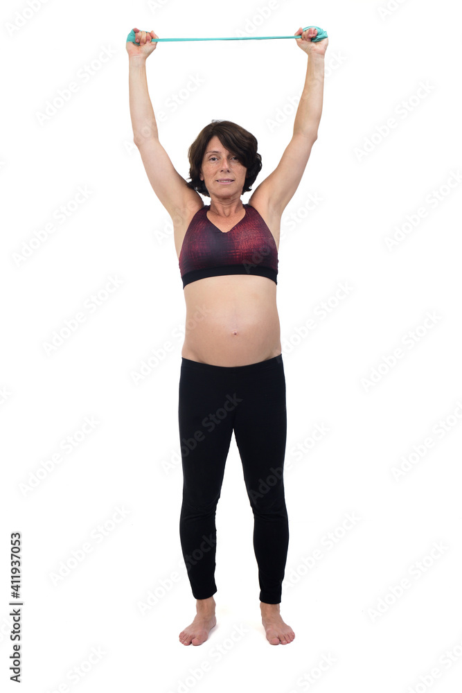 front view of a pregnant woman standing doing exercise resistance bands on white background front view of a pregnant woman standing doing exercise resistance bands on white background