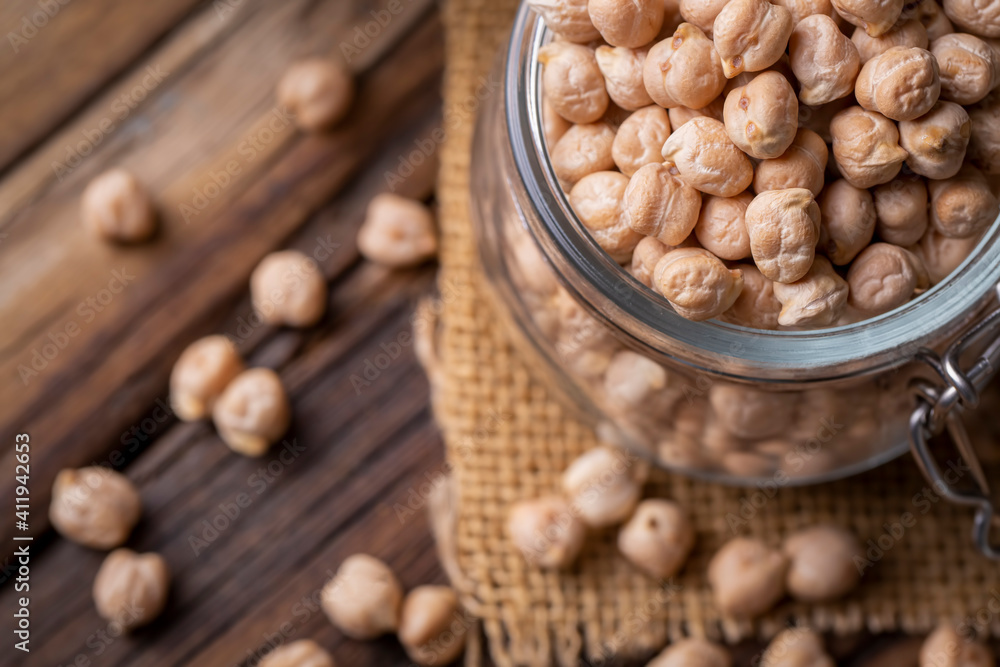 Dried raw chickpea on the wooden background Dried raw chickpea on the wooden background
