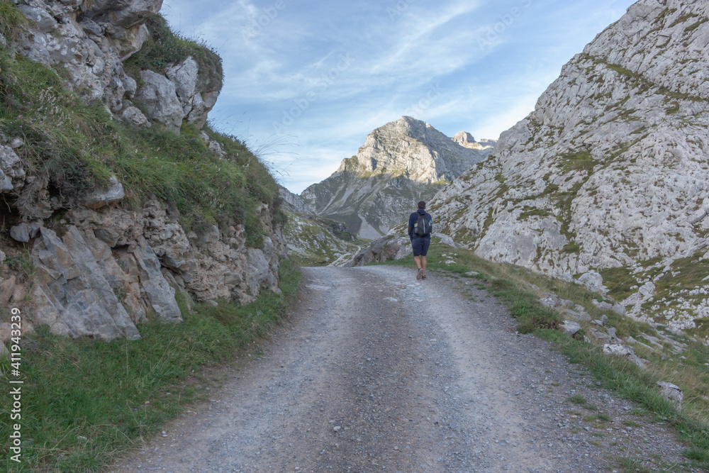 Hiker hike the Escamellau Peak. Escamellau bounds the Juan de la Cuadra range on the North, which in turn separates the Puertos de Aliva, on the East, from the Monetas valley, on the West.