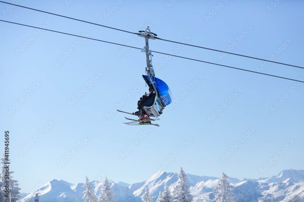 
Ski Lift above the mountain peaks. Ski resort in the Austrian Alps