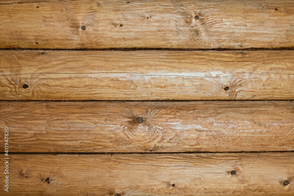 Wooden log wall texture background. Closeup wall of old wooden house. Wooden log wall texture background. Closeup wall of old wooden house.