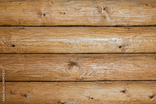 Wooden log wall texture background. Closeup wall of old wooden house.