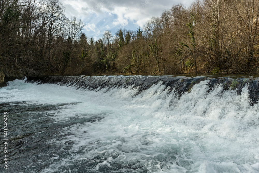 Forest waterfall of Slunjcica river, passing through the mountain forest near Plitvice lakes, Croatia Forest waterfall of Slunjcica river, passing through the mountain forest near Plitvice lakes, Croatia