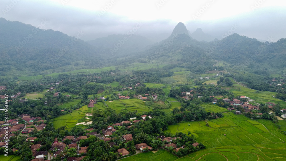 Aerial view of Rice fields on terraced of Cariu with noise cloud after rain, Bogor, Indonesia. Indonesia landscapes Aerial view of Rice fields on terraced of Cariu with noise cloud after rain, Bogor, Indonesia. Indonesia landscapes