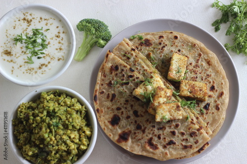 Broccoli paneer paratha. Made with whole wheat flour, with a filling of broccoli and paneer. photo