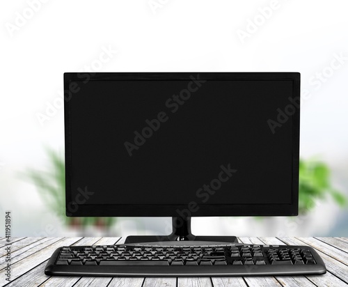 Modern desktop computer and keyboard on desk