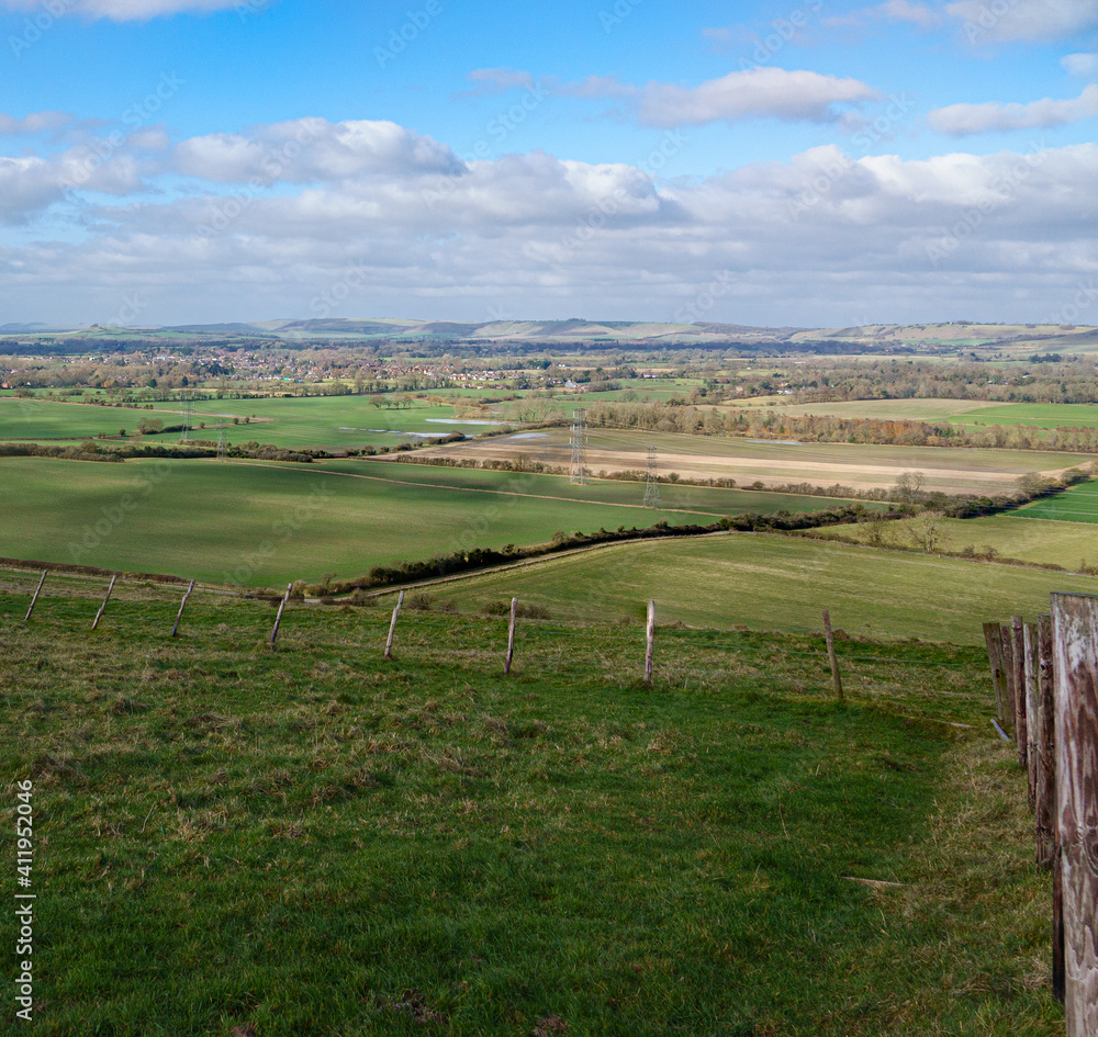 a scenic landscape view across Pewsey Vale and Pewsey Village in Wiltshire a scenic landscape view across Pewsey Vale and Pewsey Village in Wiltshire