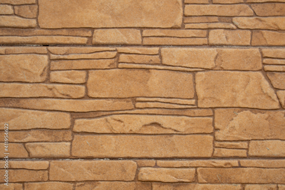 Obraz premium The texture of beige tiles is not smooth stones up close