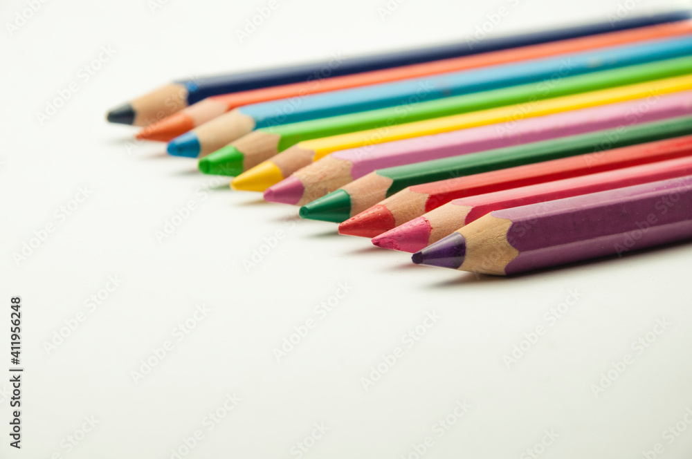 colored pencils on a white background. education concept. illustration of training. colored pencils on a white background. education concept. illustration of training.