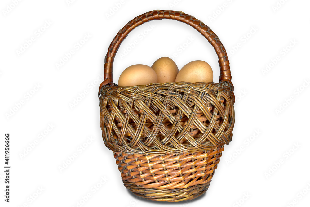 cut out wicker basket with eggs on a white background