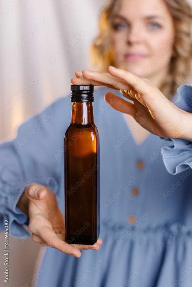 Fototapeta premium alternatives, beautiful, beauty, bottle, business, dairy, dark glass, diet, eco, environmental friendliness, essential, european, extract, female, food, girl, glass, glass bottle, green, healthy, hold