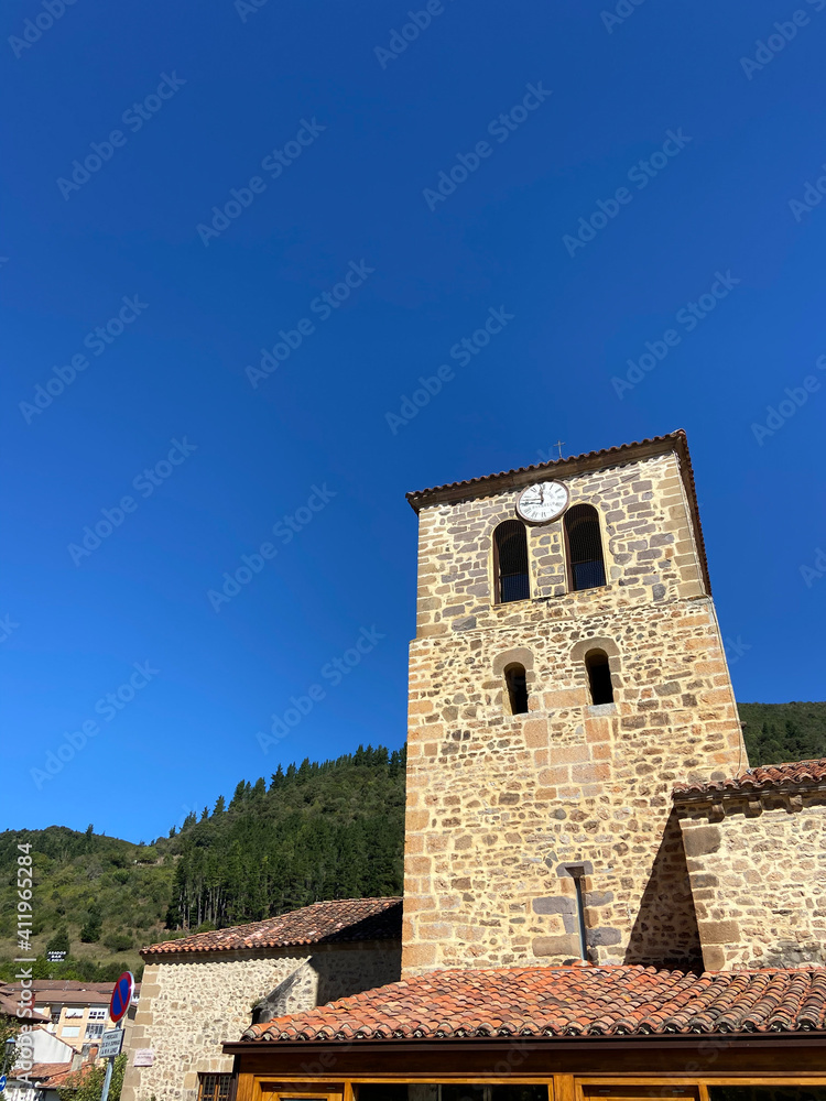 Clock tower of the old church of San Vicente in Potes, Picos de Europa, Cantabria, Spain.
