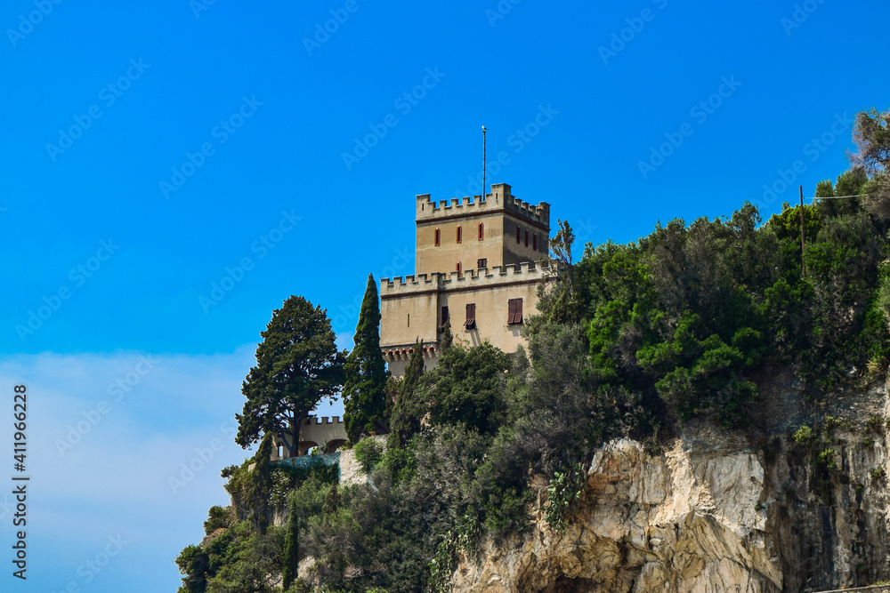 City tower on a cliff near Mediterranean Sea in Finale Ligure, Savona, Italy.