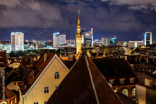 Panorama skyline of Estonian capital Talinn during night - old town in front of modern high-rise district