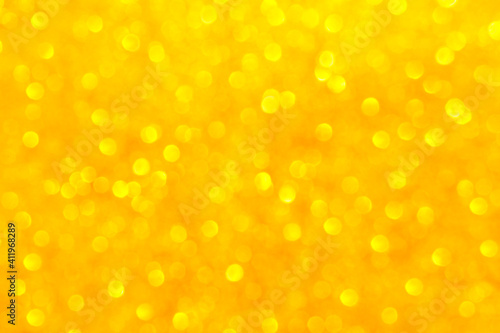 Yellow gold bokeh background. Christmas, New Year and all celebrations concept.