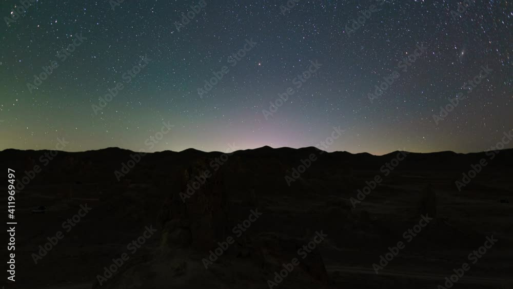 Time lapse of night to day transition of tufa towers in Trona Pinnacles in California Time lapse of night to day transition of tufa towers in Trona Pinnacles in California