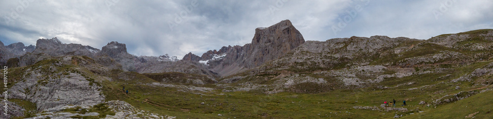 Panoramic upper start section of hiking track PR-PNP 24 to the magnificient summits of Mounts Pena Remona, Torre de Salinas, La Padierna and Pico de San Carlos at Picos de Europa National Park, Spain.