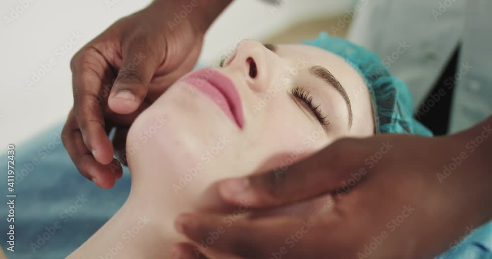 Woman pianists two hand opens the grand piano and starts playing classical music close up in slow motion. African American masseur doctor. Woman pianists two hand opens the grand piano and starts playing classical music close up in slow motion. African American masseur doctor.