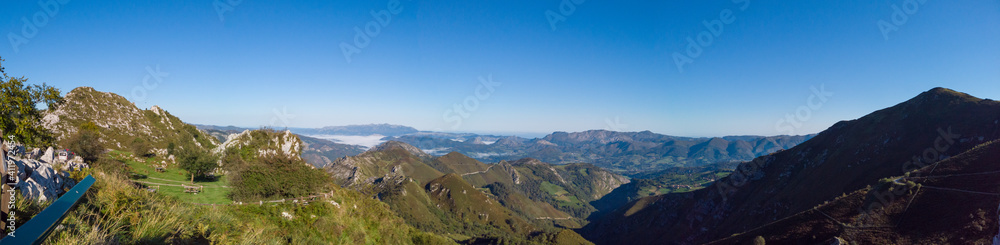 Panoramic view from Reina Lookout (Mirador de la Reina) over the mountain tops of Picos de Europa National Park, Asturias, Spain. This viewpoint is on the Los Lagos road.