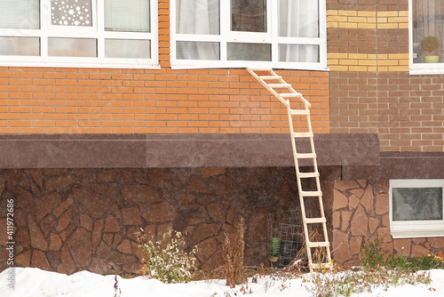 A small staircase from the balcony of a multi-storey building to the ground. photo