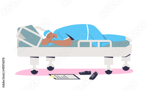 Tired doctor sleeping on gurney after hard working day in clinic or emergency hospital