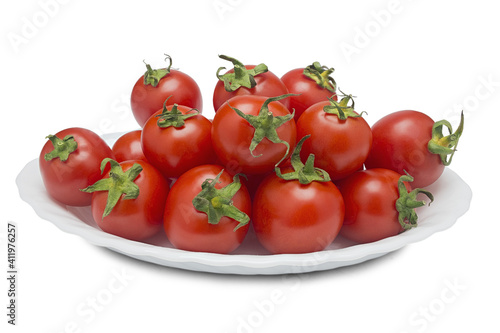 plate with red tomatoes on a white background © okskaz