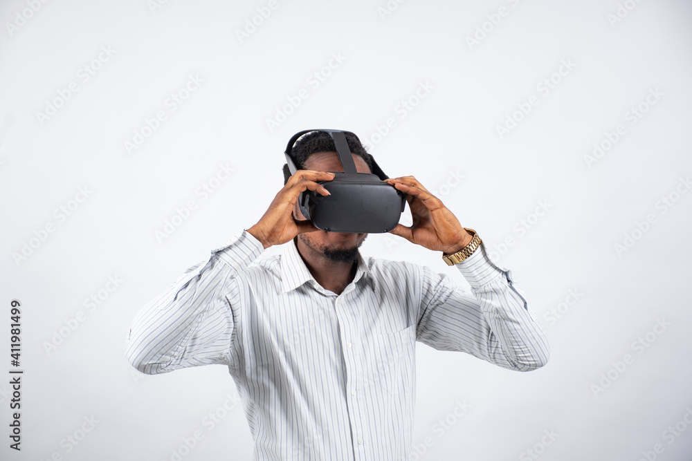 young black man putting on a virtual reality goggles young black man putting on a virtual reality goggles