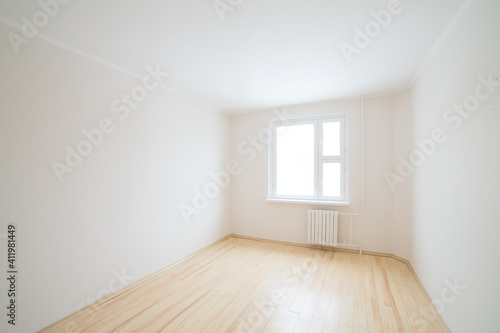 Empty white room with window.