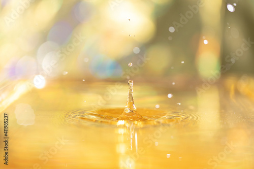 Drop of yellow water with circles