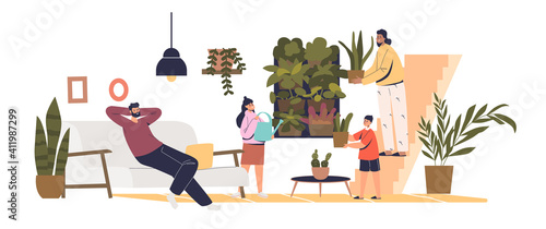 Vertical garden at home: family in living room with flower pots and green plants on wall