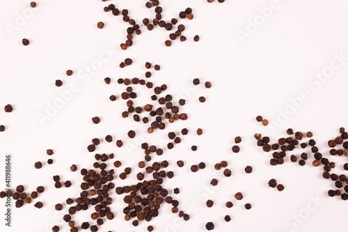 a view from afar of dark balls scattered on a white surface