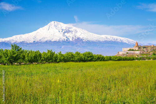 Awe-Inspiring medieval Khor Virap monastery in front of Mount Ararat viewed from Yerevan  Armenia. This snow-capped dormant compound volcano described in the Bible as the resting place of Noah s Ark.