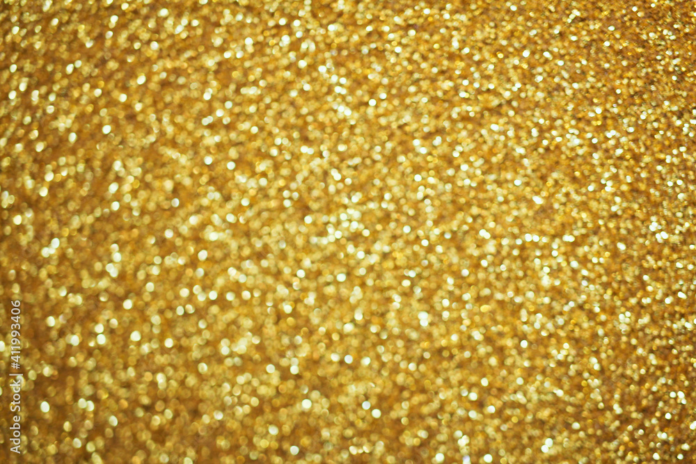 Gold defocused glitter. Bokeh light of gold glitters background. Gold defocused glitter. Bokeh light of gold glitters background.