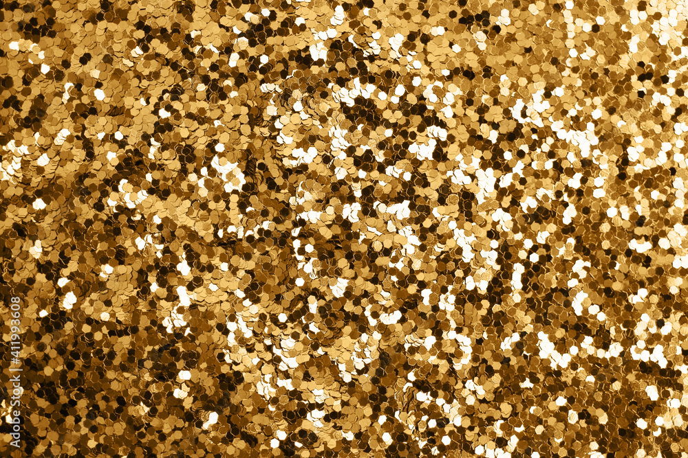 Gold defocused glitter. Bokeh light of gold glitters background. Gold defocused glitter. Bokeh light of gold glitters background.