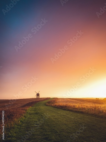 Traditional windmill in rural landscape at sunrise, Warwickshire, England, UK photo
