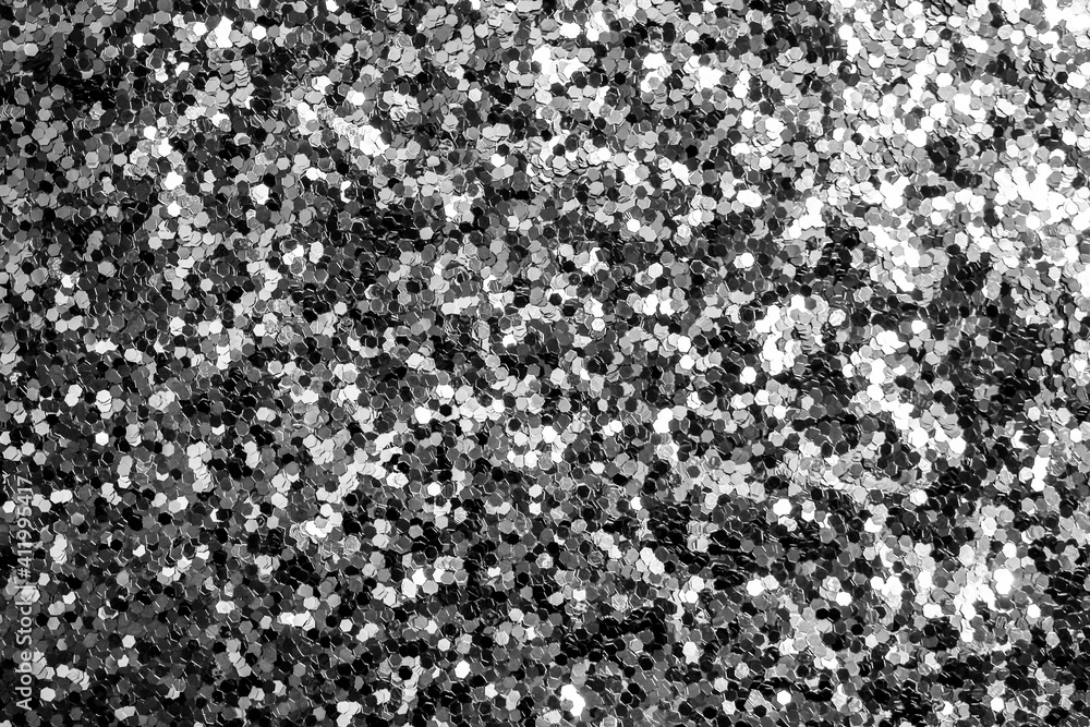 Silver defocused glitter. Bokeh light of gold glitters background. Silver defocused glitter. Bokeh light of gold glitters background.